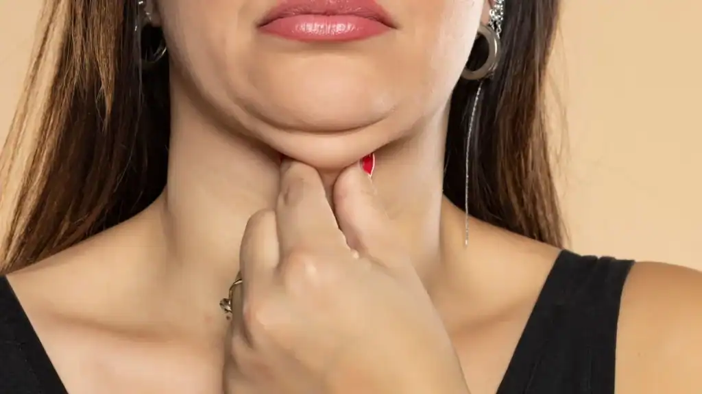 An image of a woman with double chin, sad, worried : Non Surgical Double Chin Removal Treatment in Ravensthorpe, UK
