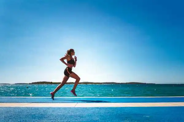 Woman running showing strong leg muscle Ravensthorpe